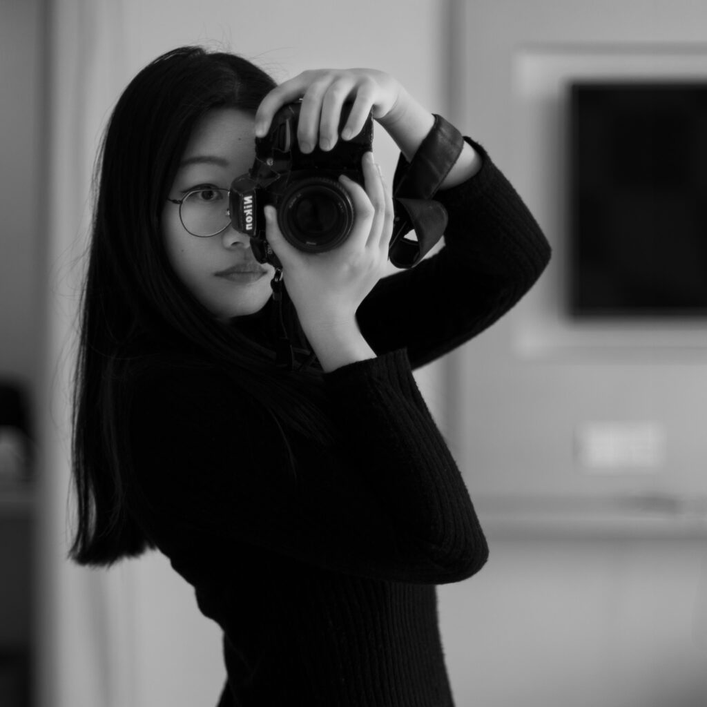 About Min #1 Boudoir Photographer - Min Holding Her Camera